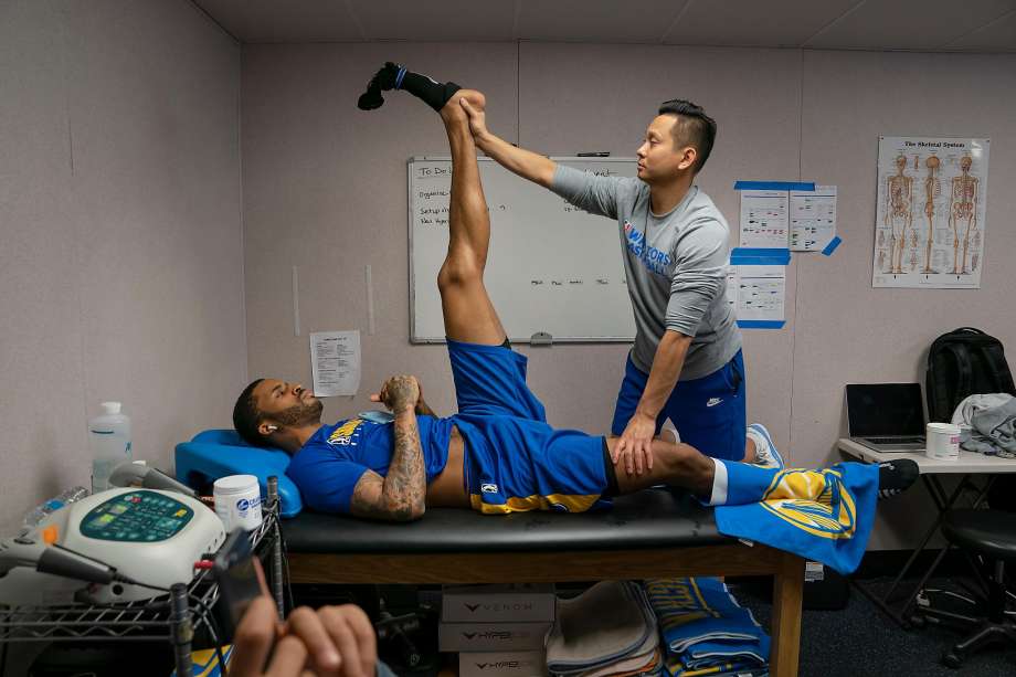 Santa Cruz Warriors Head Athletic Trainer Long Lam (right) helped Warriors guard Vander Blue with a stretch and soft tissue release before at G League game against the Windy City Bulls at the Kaiser Permanente Arena in Santa Cruz. Photo: Photos By LiPo Ching / Special To The Chronicle