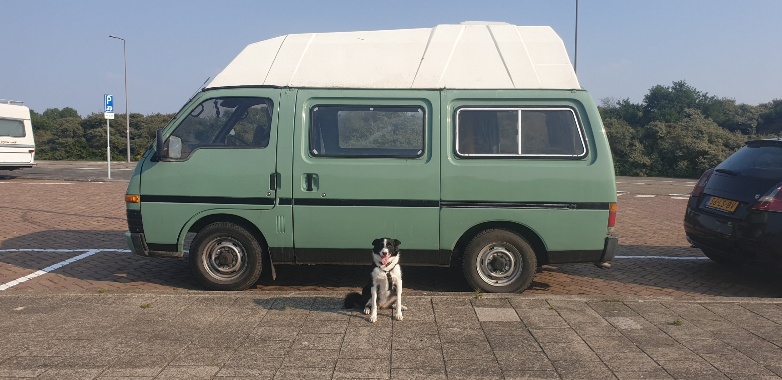 Caitlin Mooney, 25, bought her 1985-built Bedford Midi camper for ?3,000. See SWNS story SWSCvan; A student in a bid to free herself from rent and bills is converting a 35-year-old campervan into her new home. Caitlin Mooney, 25, bought her 1985-built Bedford Midi camper for ?3,000 in May last year and has been working to convert it into her new pad ever since. Frustrated with working and seeing hundreds from her earnings as a digital artist going on rent, bills and council tax, Caitlin decided she wanted to live a minimalist lifestyle rent free. Caitlin, who is currently studying a masters in mobile web development in Paisley, Renfrewshire, where she also lives, spends her spare time kitting out her campervan - called ?Olive?. She is also planning on fitting a small kitchen area and she also has a portaloo. Caitlin will graduate from university this year and is hoping to give up her flat where she pays ?250 for rent and bills.