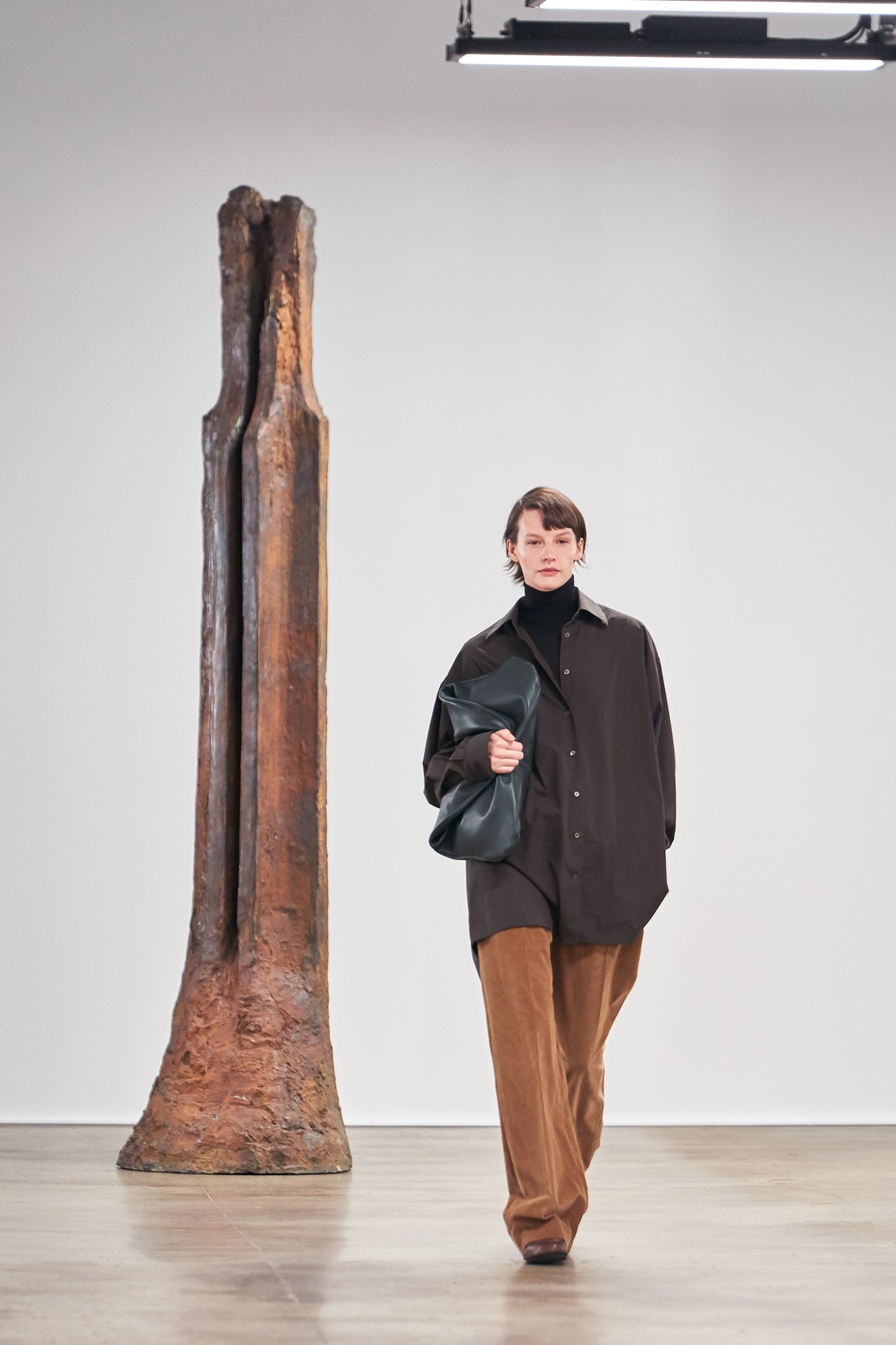 Image may contain Clothing Apparel Human Person Coat Saskia de Brauw Overcoat and Footwear