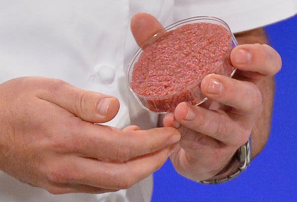 A chef preparing to cook the world’s first lab-grown beef burger during a launch event in west London, August 5, 2013.