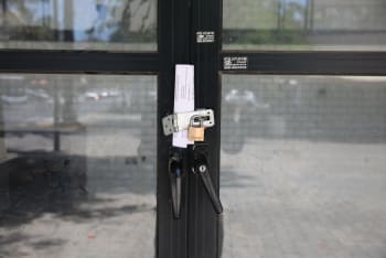 A padlock on the door of a business in Holon, June 2020.