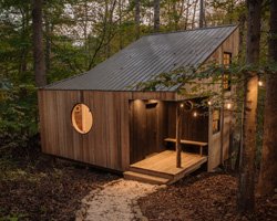 local materials + traditional craft techniques make shelter's tiny 'nook' cabin in north carolina