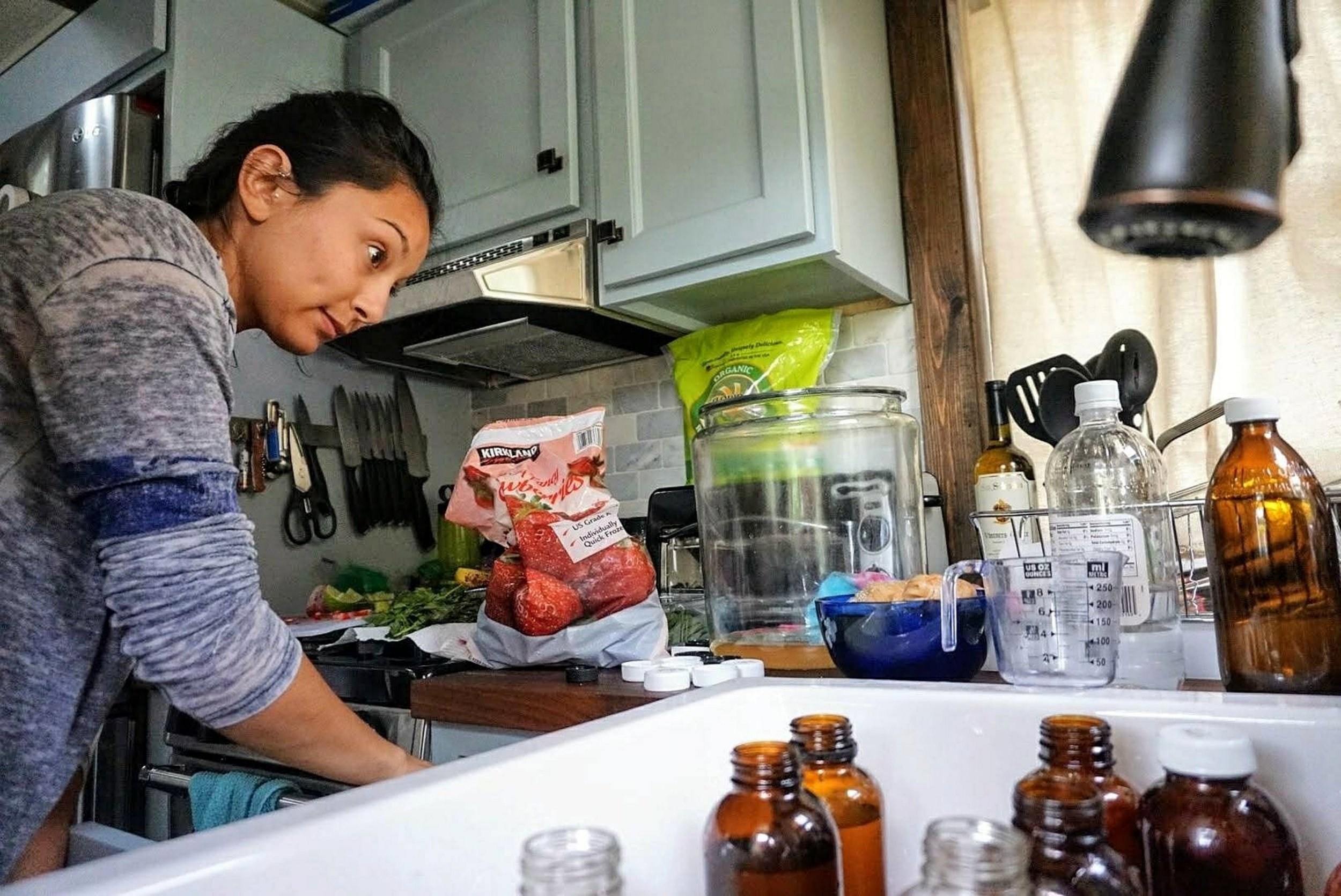 Sam cooking in the tiffany tiny home