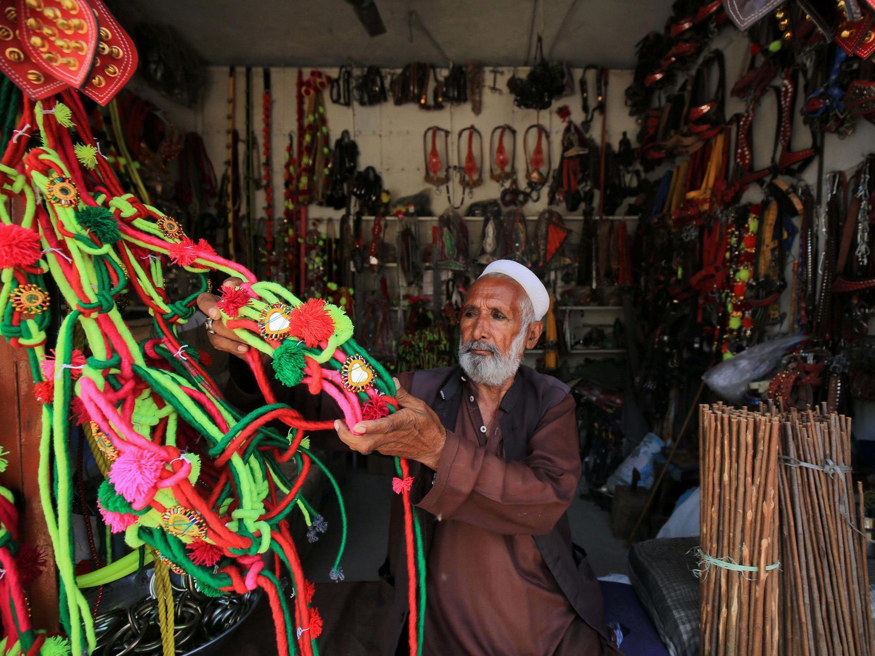 Ornaments for sacrificial animals on sale at a roadside ahead of the Muslim festival of Eid Al Adha in Peshawar, Pakistan, July 23. Bilawal Arbab/ EPA