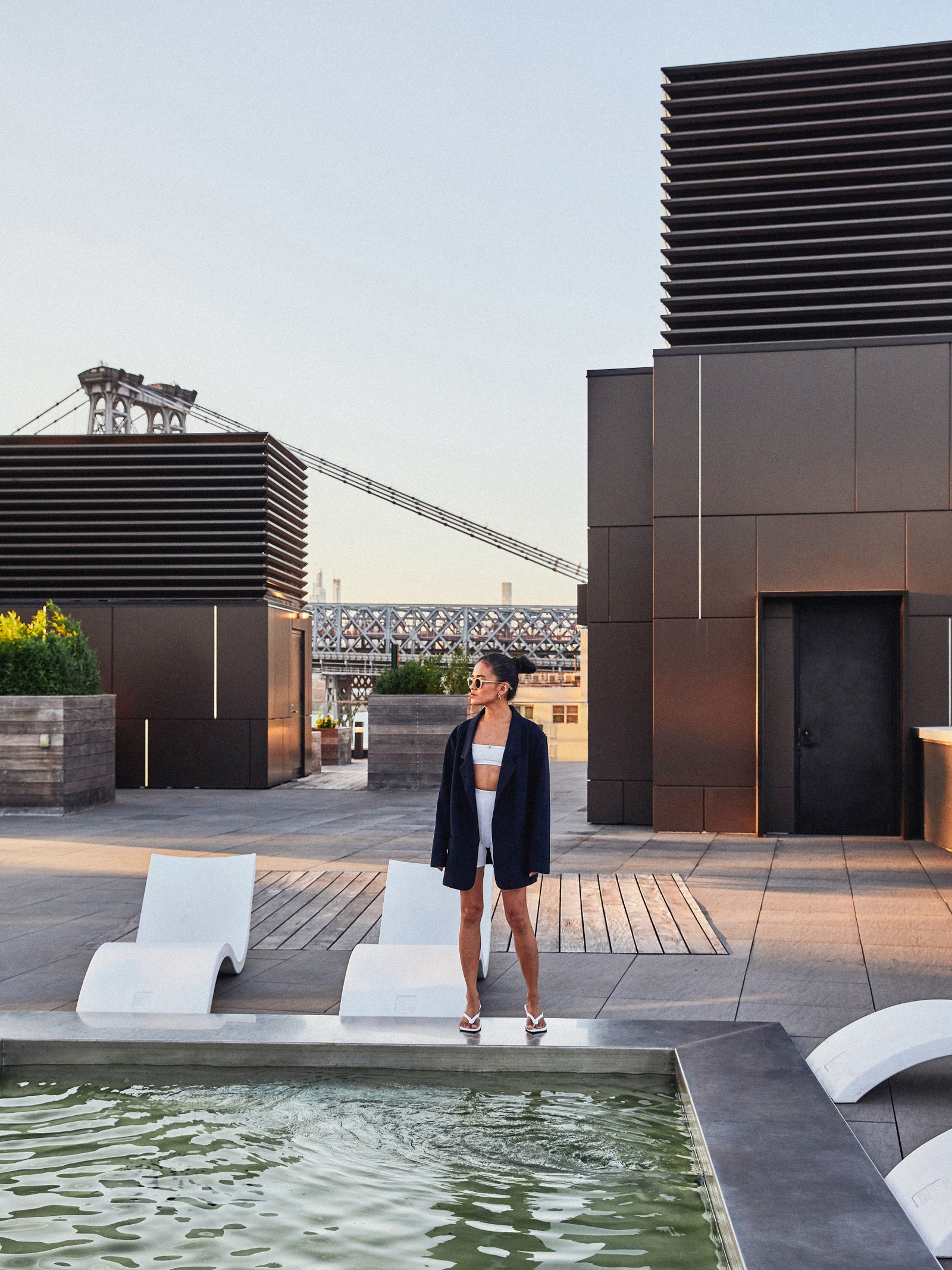 pOlivia taking full advantage of her building's amenities which include an outdoor pool and a private interior courtyard.p 