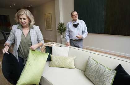The Barndollars brought bags of decorative pillows to disperse throughout rooms in this house.