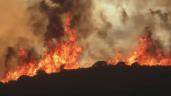 a fire with smoke coming out of it: A fast-moving wildfire forcing the evacuation of more than a hundred homes in Southern California. The Lake Fire north of Los Angeles has already scorched more than 10,000 acres.