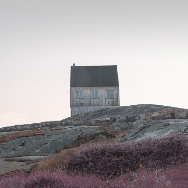 John Kosmopoulos, Oqaatsut Homes. Oqaatsut is a small Greenlandic town north of Ilulissat in Eastern Disko Bay. As the sun drenched and warmed the colourful homes and rocky landscape, it revealed clues of what life must be like there: a close but isolated community where the spirits of icebergs come and go in the distance. I wanted to convey the feeling of the town by using minimalist compositions and creative framing to provide portraits of life in Greenland. Most of the citizens were indoors, but one citizen overlooked our whereabouts while children played a game and chanted a song that echoed through the town.