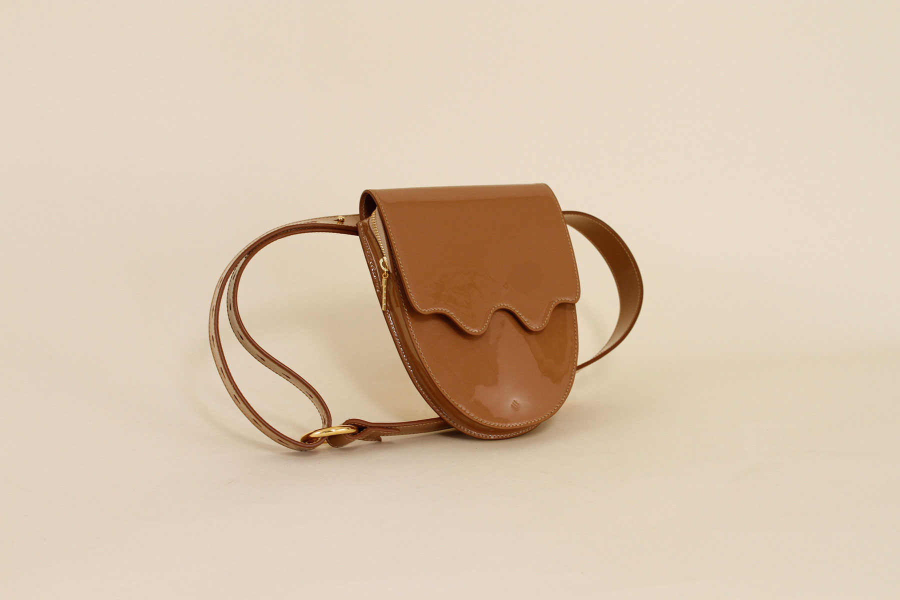 Brown shiny leather sling bag