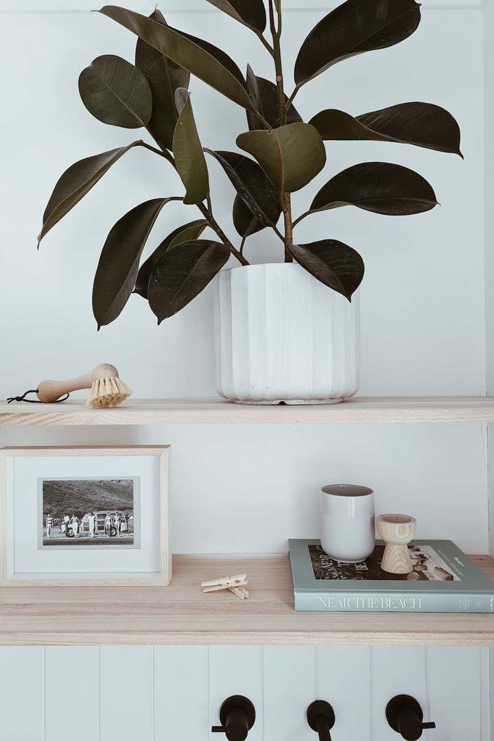 Timber shelves and decorations in laundry room