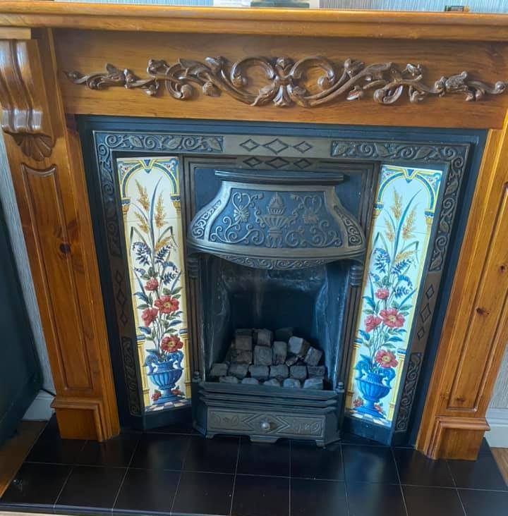  Before the bloke painted it navy, the fireplace was painted with flowers