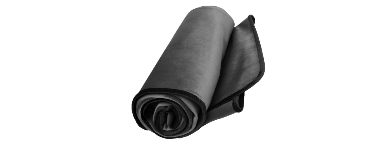 a grey soft-looking blanket rolled up