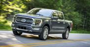 a car parked on the side of a road: 2021 F-150 Limited