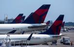 Delta Airlines planes sit at Terminal 4 at John F. Kennedy Airport July 22, 2014 in New York City.