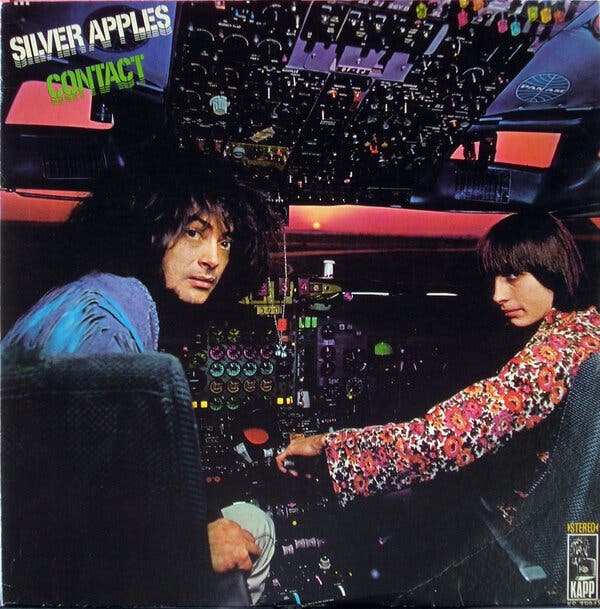 Mr. Coxe, left, and Dan Taylor of Silver Apples on the cover of their 1969 album, “Contact.” A picture of a crashed plane on the back cover led to a lawsuit, and band broke up not long afterward.