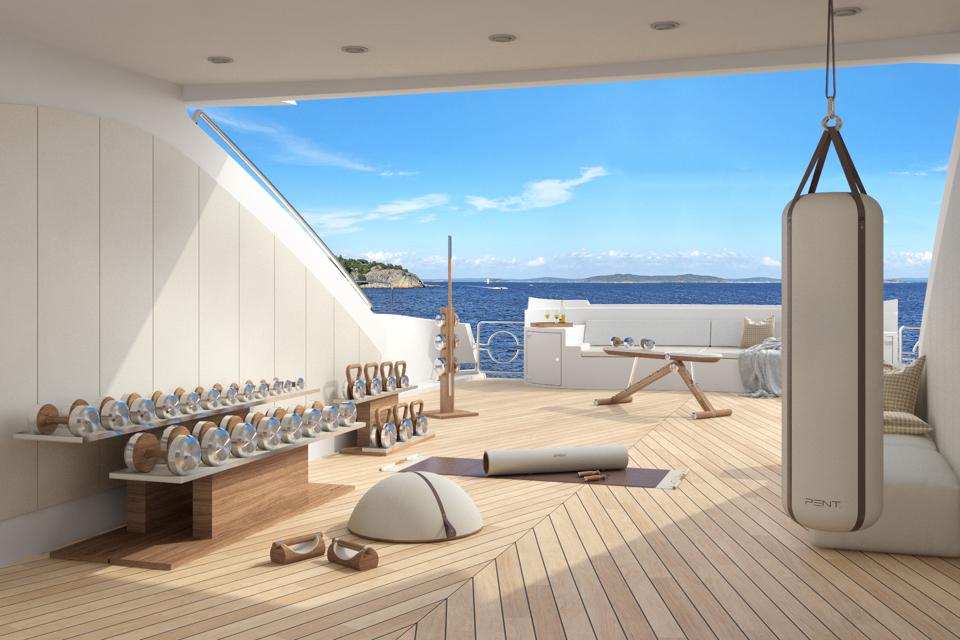 A gym on board a yacht overlooking the ocean.