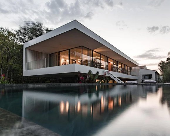 brengues le pavec adds mirror swimming pool to house extension in the south of france